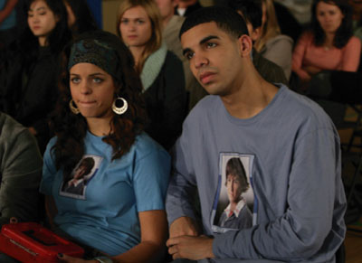 On-Screen Appearance – Remember J.T. Tee (2007)
Scene from Degrassi: The Next Generation Season 6, Episode 12 ("The Bitterest Pill"), featuring Ashley Kerwin (Melissa McIntyre) and Jimmy Brooks (Aubrey Graham) wearing the official Remember J.T. shirts during J.T. Yorke’s memorial.
Keywords: Degrassi;Remember J.T.;on-screen;episode appearance;The Bitterest Pill;Ashley Kerwin;Jimmy Brooks;Melissa McIntyre;Aubrey Graham;J.T. Yorke;Season 6;tribute;memorial