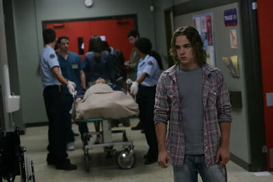 Sean Cameron at the Hospital as J.T. Yorke Receives Emergency Treatment
Sean Cameron (Daniel Clark) stands in the hospital corridor as medical staff attend to J.T. Yorke (Ryan Cooley), who lies on a hospital bed following his stabbing.
Keywords: Daniel Clark;Ryan Cooley;Sean Cameron;J.T. Yorke;JT Yorke;Degrassi;Degrassi The Next Generation;Rock This Town;Season 6;episode promotional photograph;hospital;hospital bed;emergency treatment;stabbing